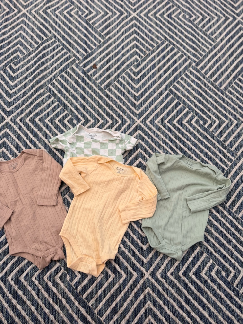 Set of Four Kids One-Piece Bodysuits in Sage, Cream, Tan, and Check